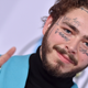 Illustration for article titled Post Malone, who has a Nirvana face tattoo, is doing some Nirvana covers for COVID-19 relief